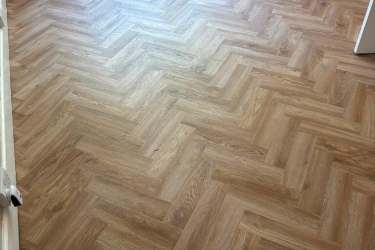 Herringbone LVT flooring installed in a Birmingham lounge